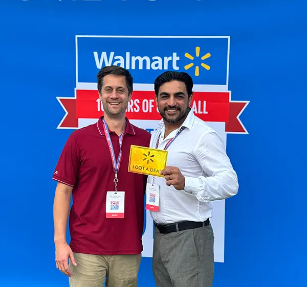 Two of the Cham Bakery team at Walmart Open Call, holding the Golden Ticket